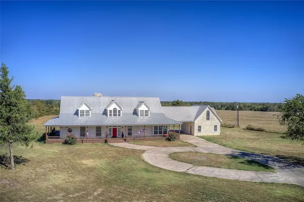 a view of a house with a big yard