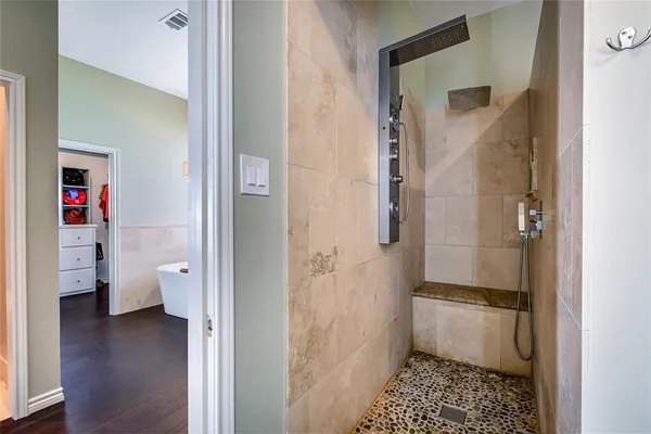a bathroom with a shower and a toilet