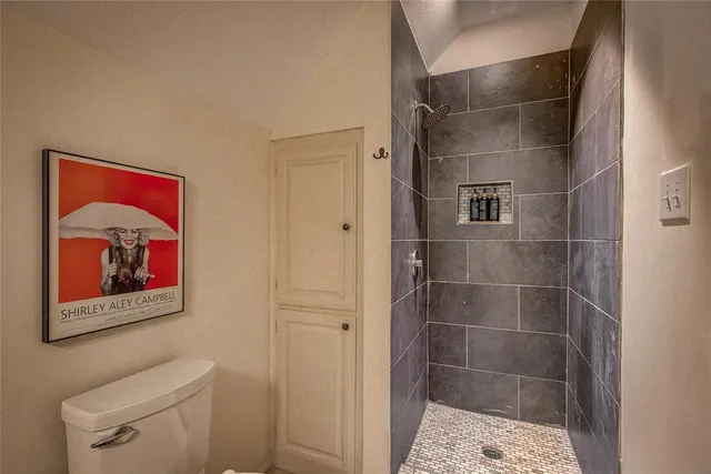 a view of a livingroom with furniture and a window