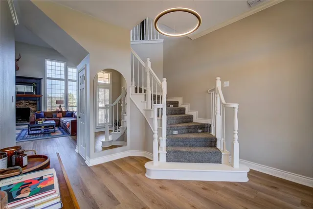 a view of entryway and hall with wooden floor