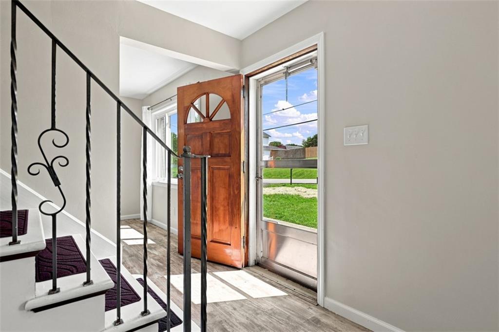 545 Center Hill Road Pittsburgh, PA 15239 - Photo 5 of 48 Step inside to a bright and inviting entry featuring neutral finishes, updated flooring, and plenty of natural light.