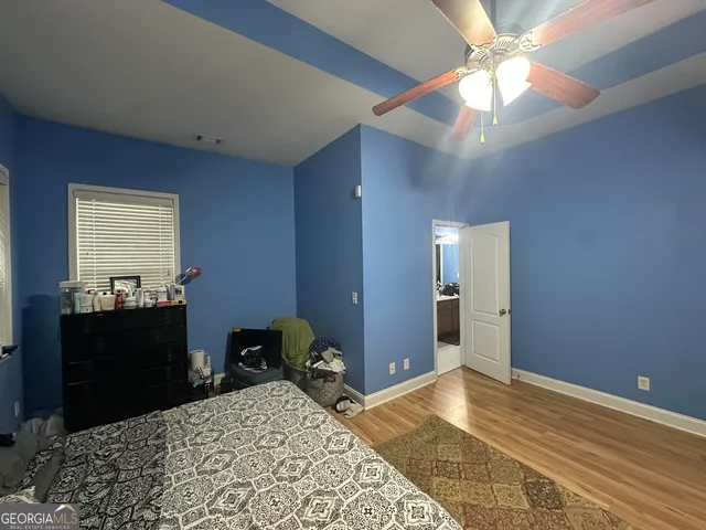 a bed room with a bed and a chandelier