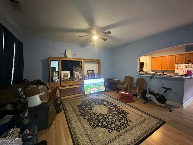 a living room with furniture and a rug