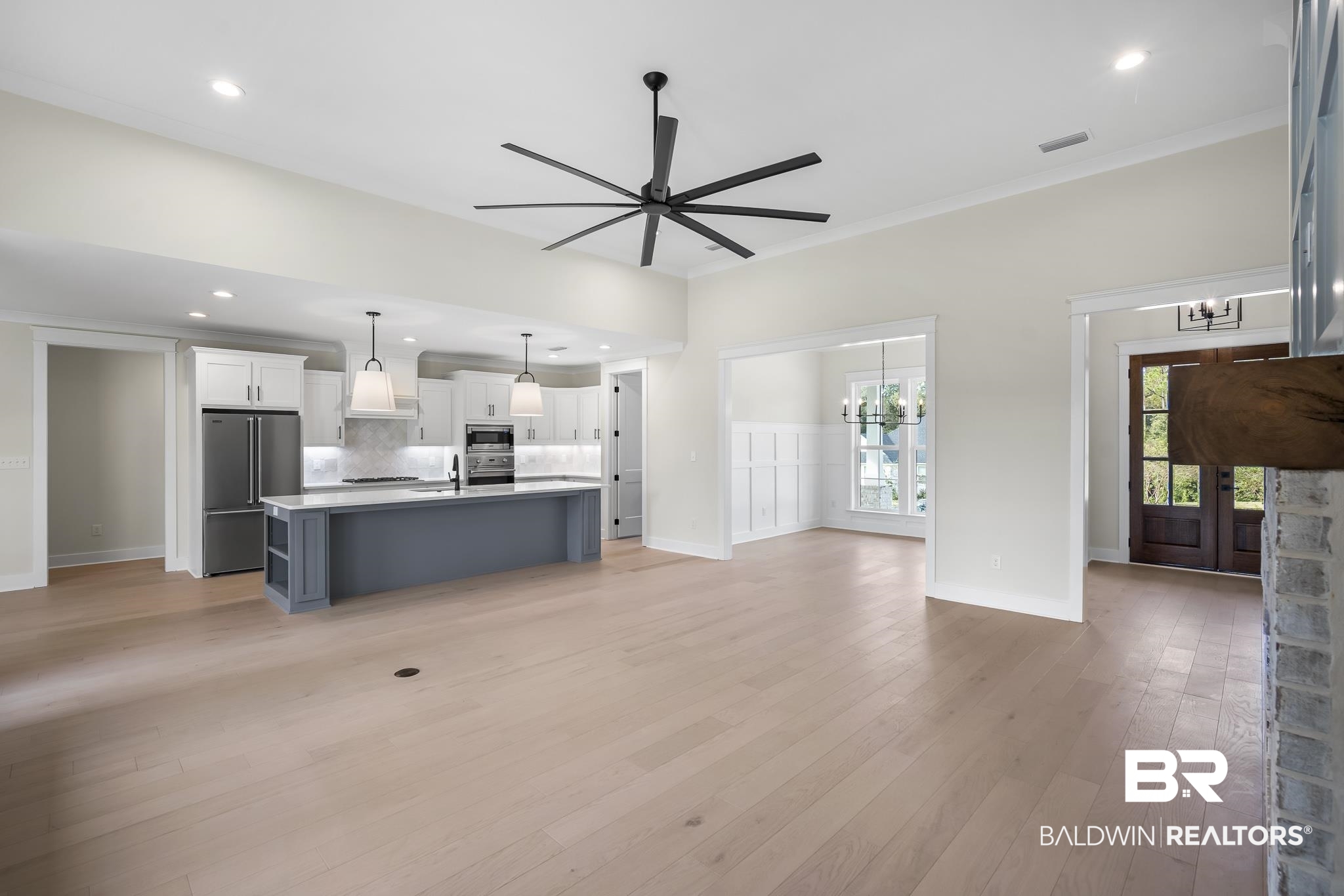 21826 Veranda Boulevard Fairhope, AL 36532 - Photo 4 of 42 Unfurnished living room with recessed lighting, a chandelier, light wood-style flooring, ceiling fan, and crown molding