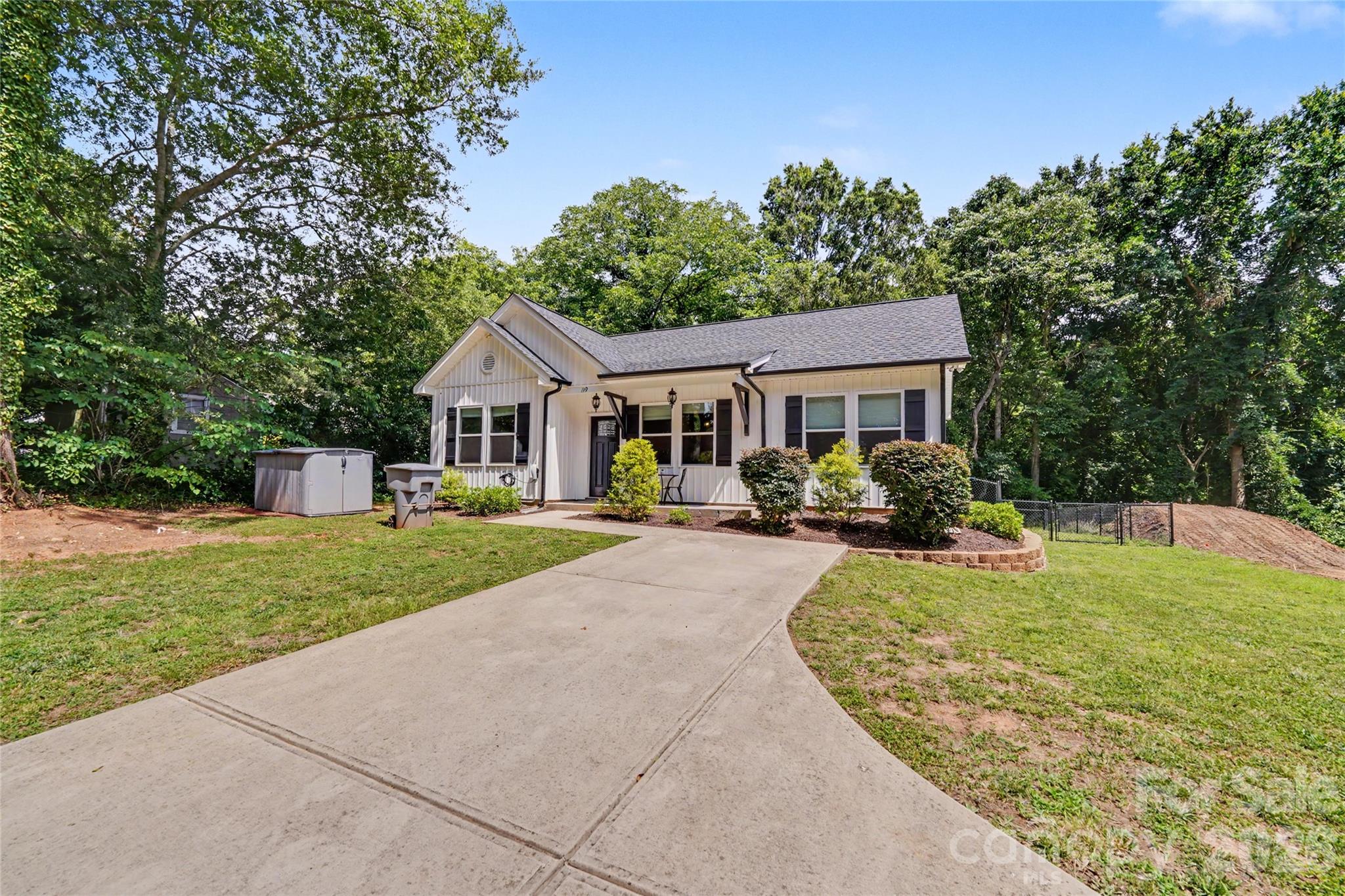 119 Brown Street Clover, SC 29710 - Photo 2 of 24 a front view of a house with garden