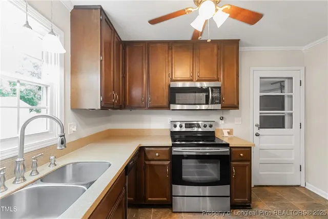 a kitchen with granite countertop a stove and a sink