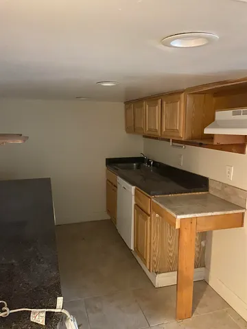 a kitchen that has a sink and a stove