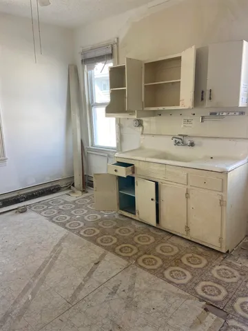 a bathroom with a sink vanity and mirror
