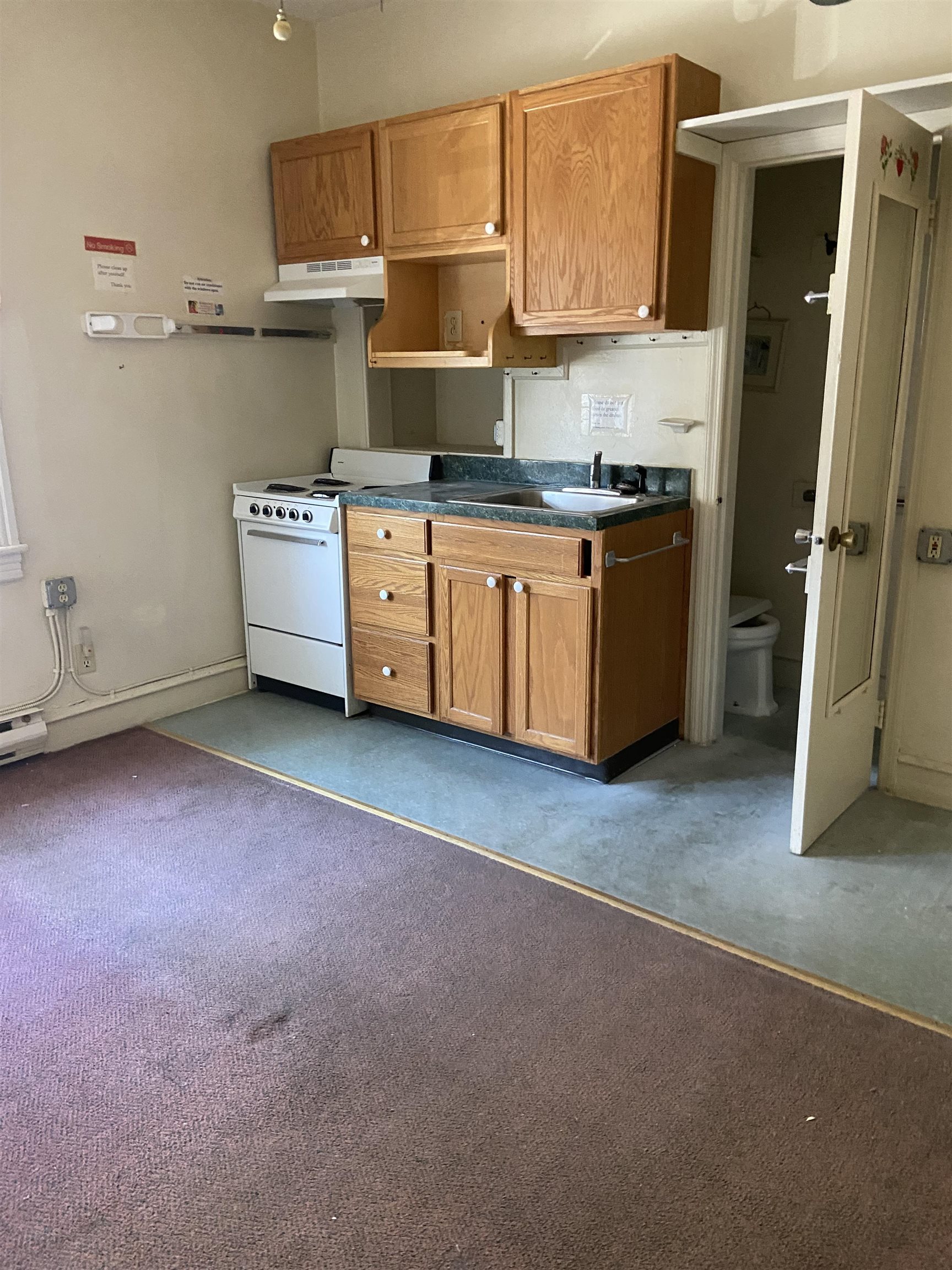 611 East 7th Street Ocean City, NJ 08226 - Photo 3 of 27 a kitchen with stainless steel appliances a sink a stove a refrigerator cabinets and a counter top space