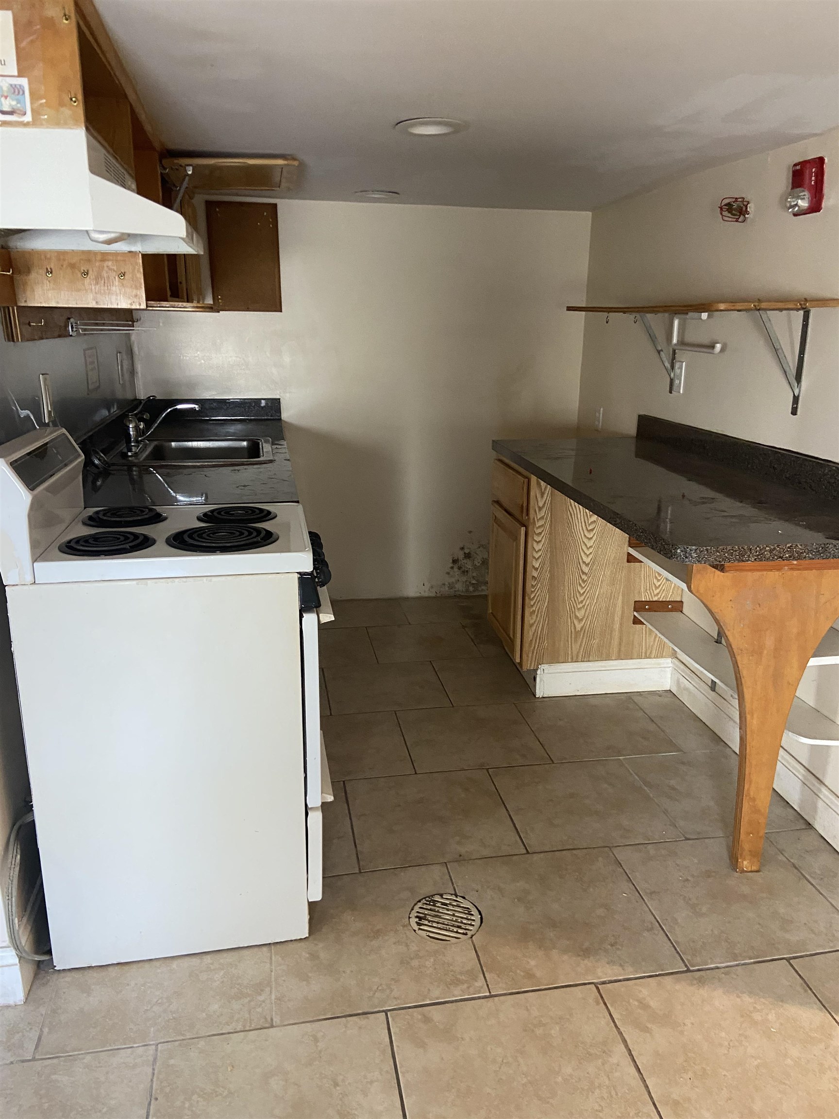 611 East 7th Street Ocean City, NJ 08226 - Photo 10 of 27 a kitchen with stainless steel appliances granite countertop a sink and a stove