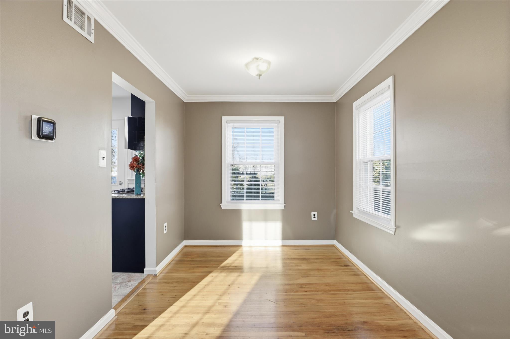 2238 Arlington Terrace Alexandria, VA 22303 - Photo 12 of 37 a bedroom with wooden floor and windows