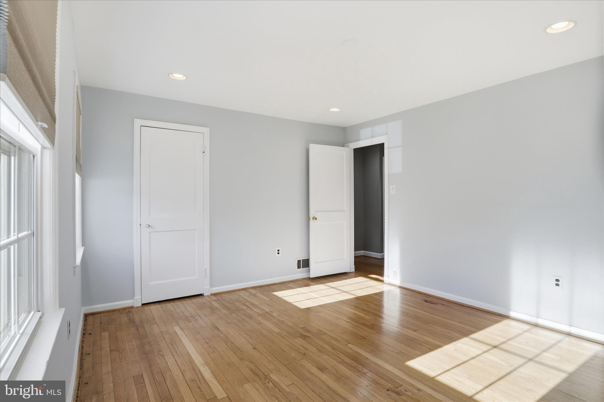 2238 Arlington Terrace Alexandria, VA 22303 - Photo 14 of 37 an empty room with wooden floor and windows