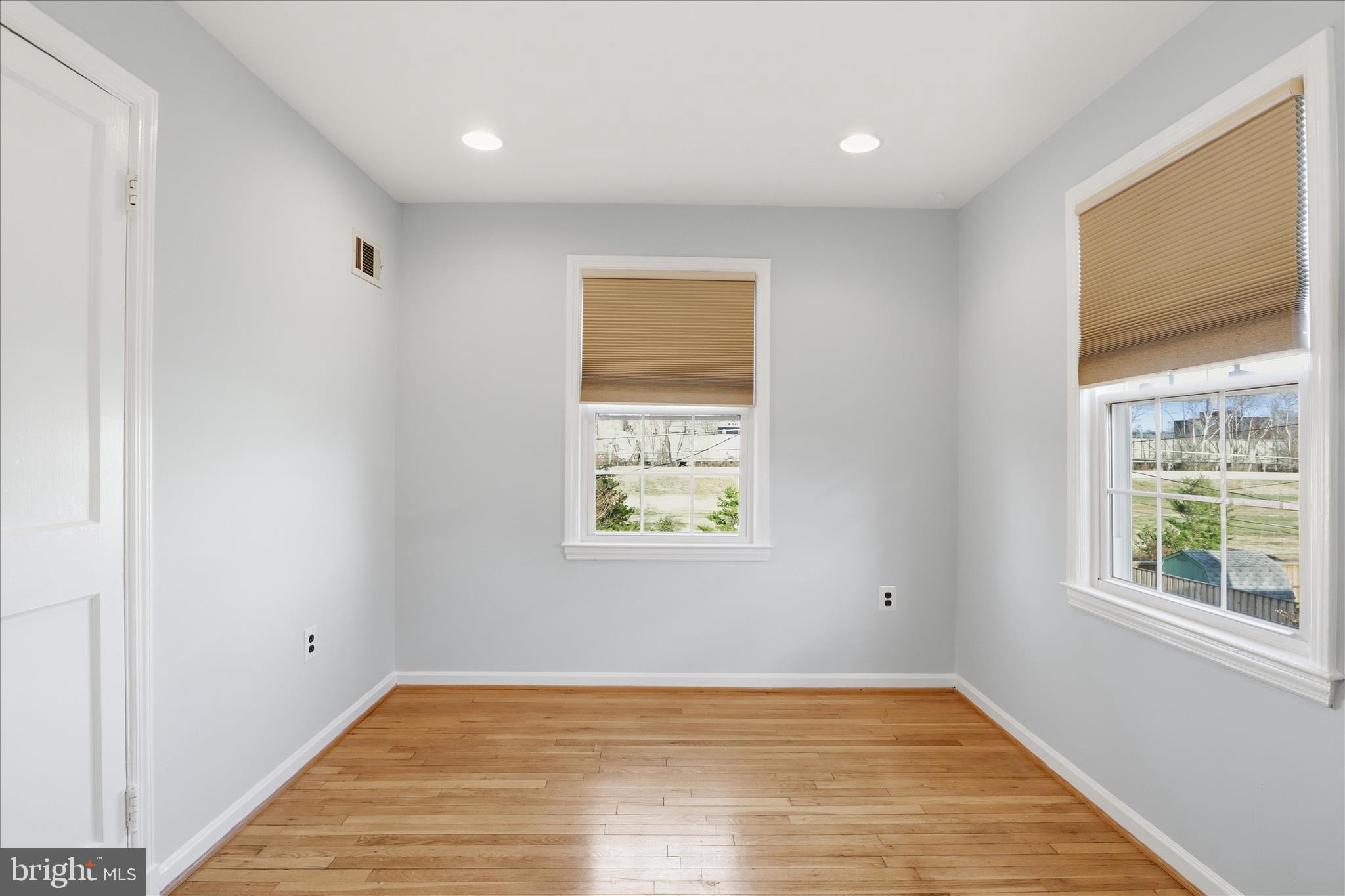 2238 Arlington Terrace Alexandria, VA 22303 - Photo 18 of 37 a view of an empty room with wooden floor and a window