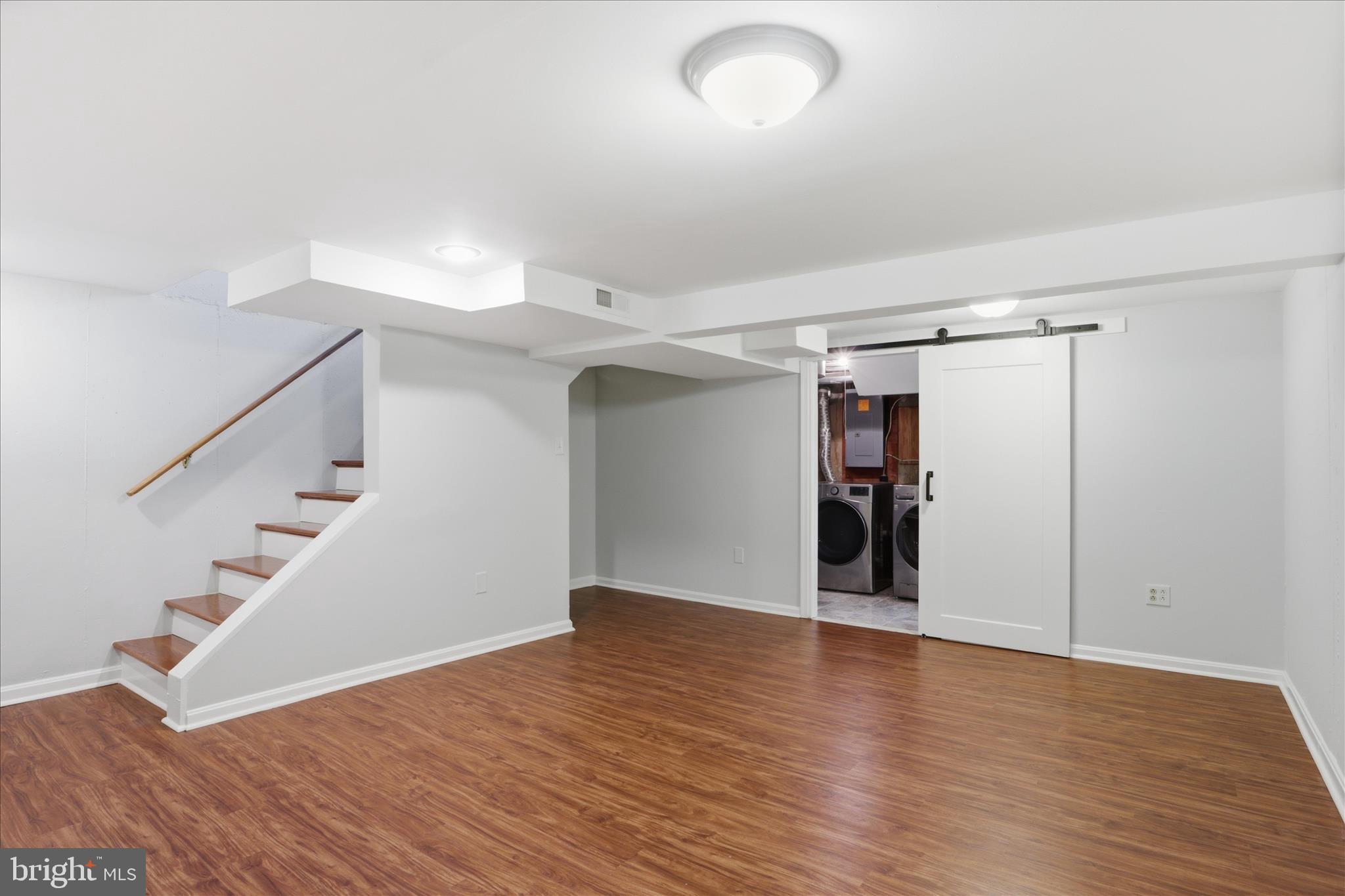 2238 Arlington Terrace Alexandria, VA 22303 - Photo 20 of 37 a view of an empty room with wooden floor and stairs