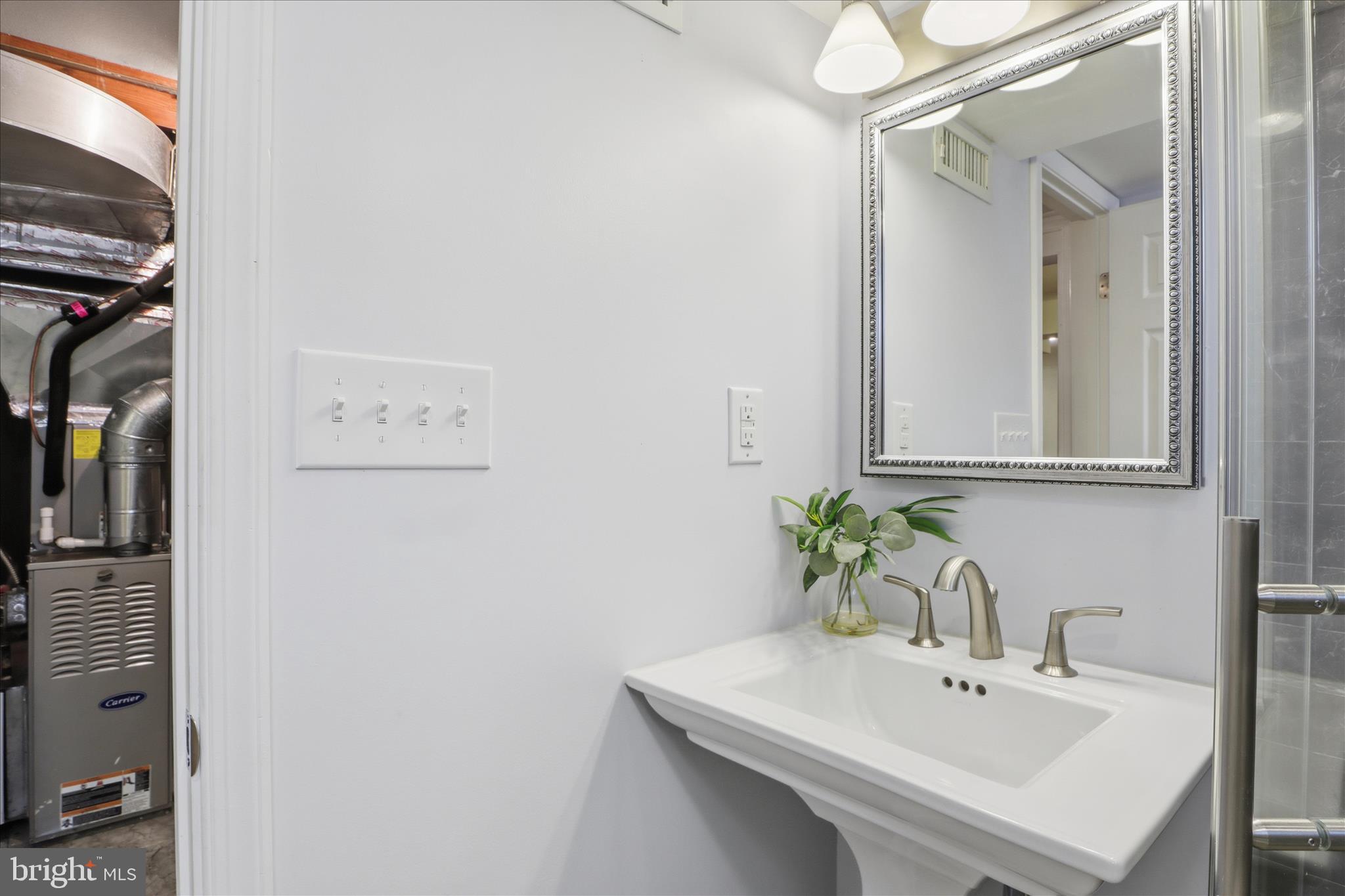 2238 Arlington Terrace Alexandria, VA 22303 - Photo 21 of 37 a bathroom with a sink and a mirror