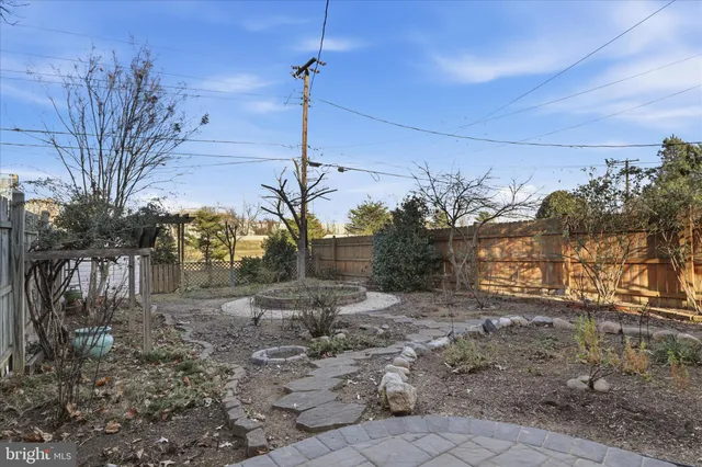 a view of a road with a house in the background