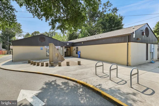 a view of a balcony with two chairs and a table