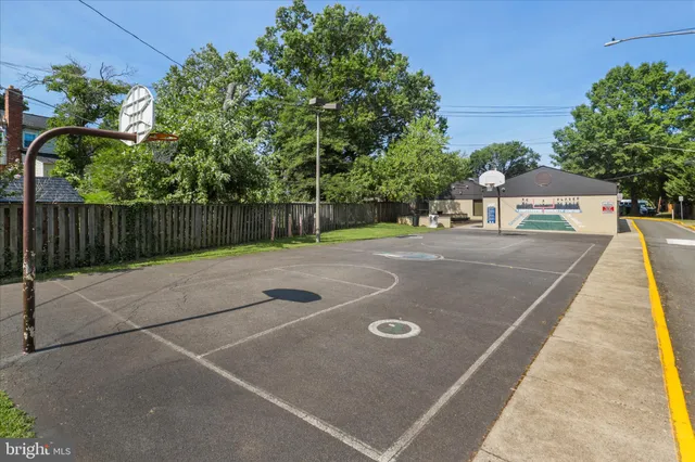a view of a patio with a table and chairs