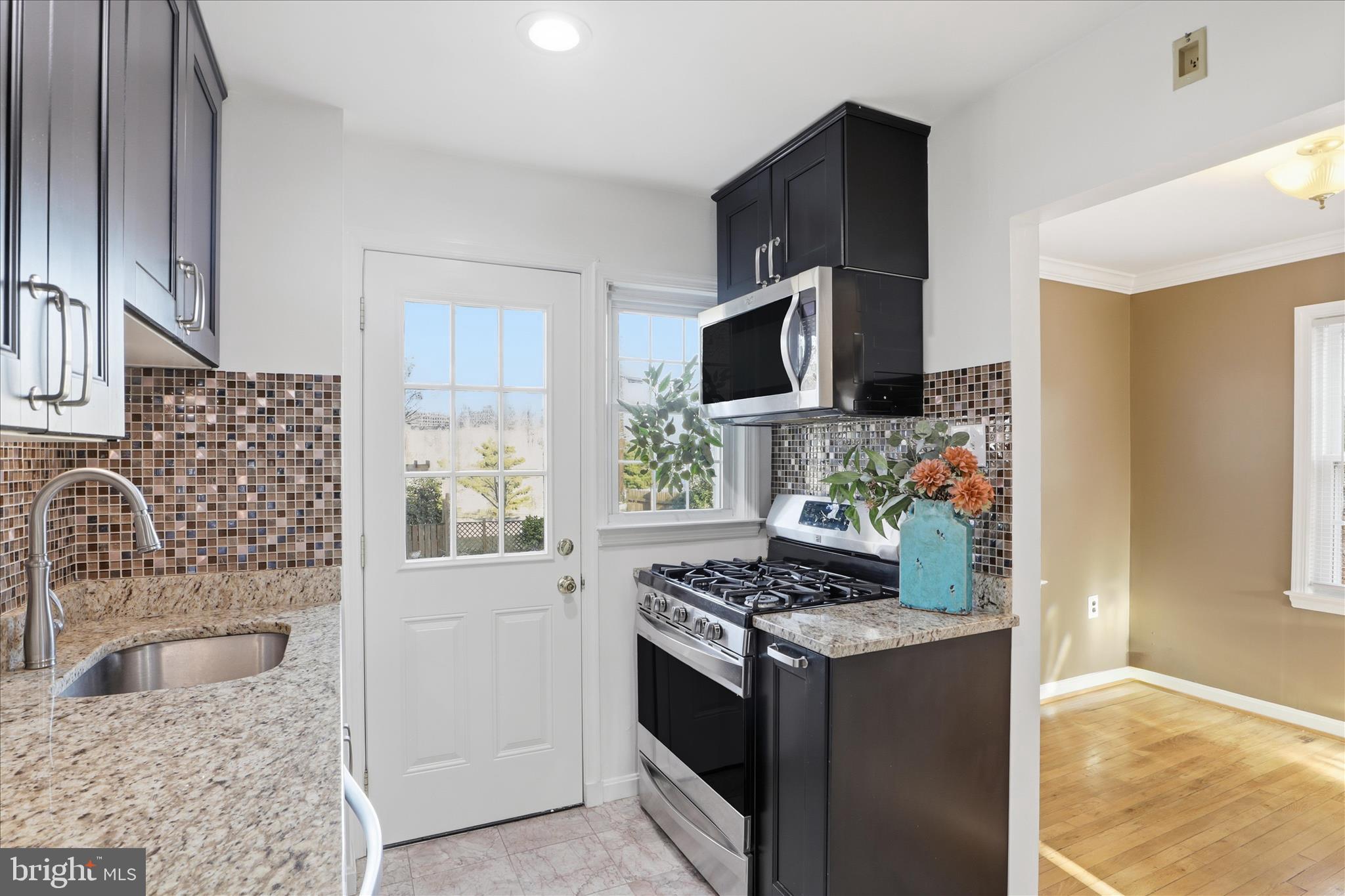 2238 Arlington Terrace Alexandria, VA 22303 - Photo 5 of 37 a kitchen with stainless steel appliances granite countertop a sink stove and refrigerator