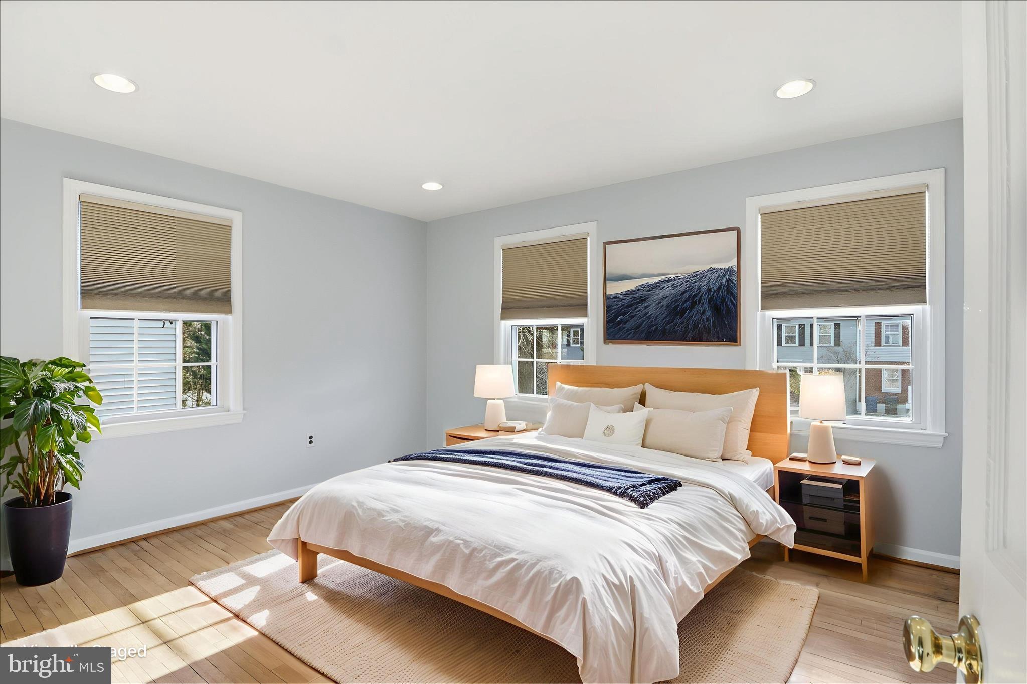 2238 Arlington Terrace Alexandria, VA 22303 - Photo 7 of 37 a bedroom with a bed and a potted plant