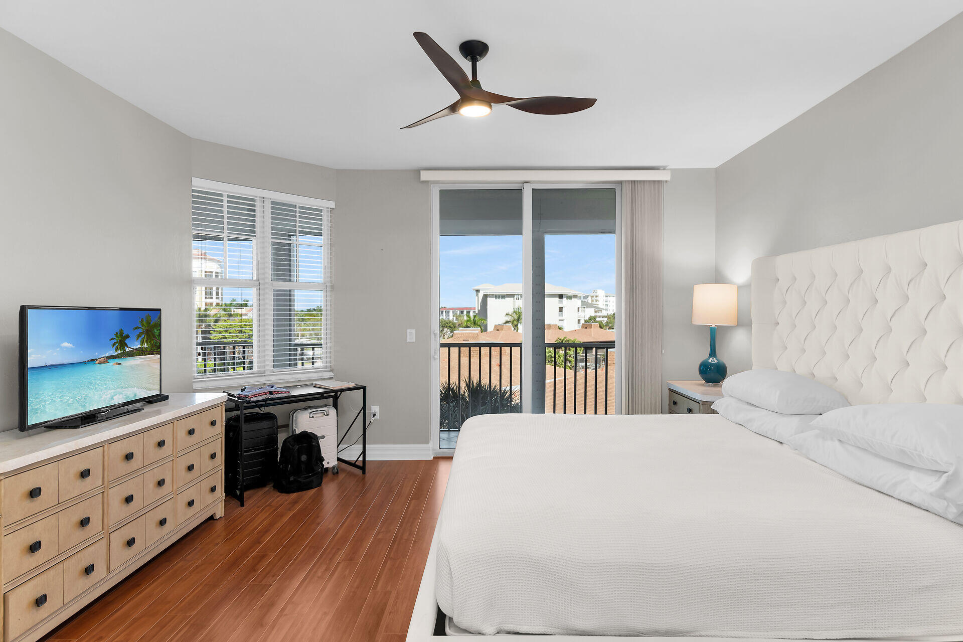 1111 Swallow Avenue, Unit 1401 Marco Island, FL 34145 - Photo 24 of 36 a bedroom with a bed and a flat screen tv on dresser