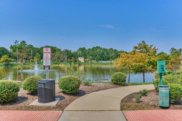 a view of a lake with houses in the background
