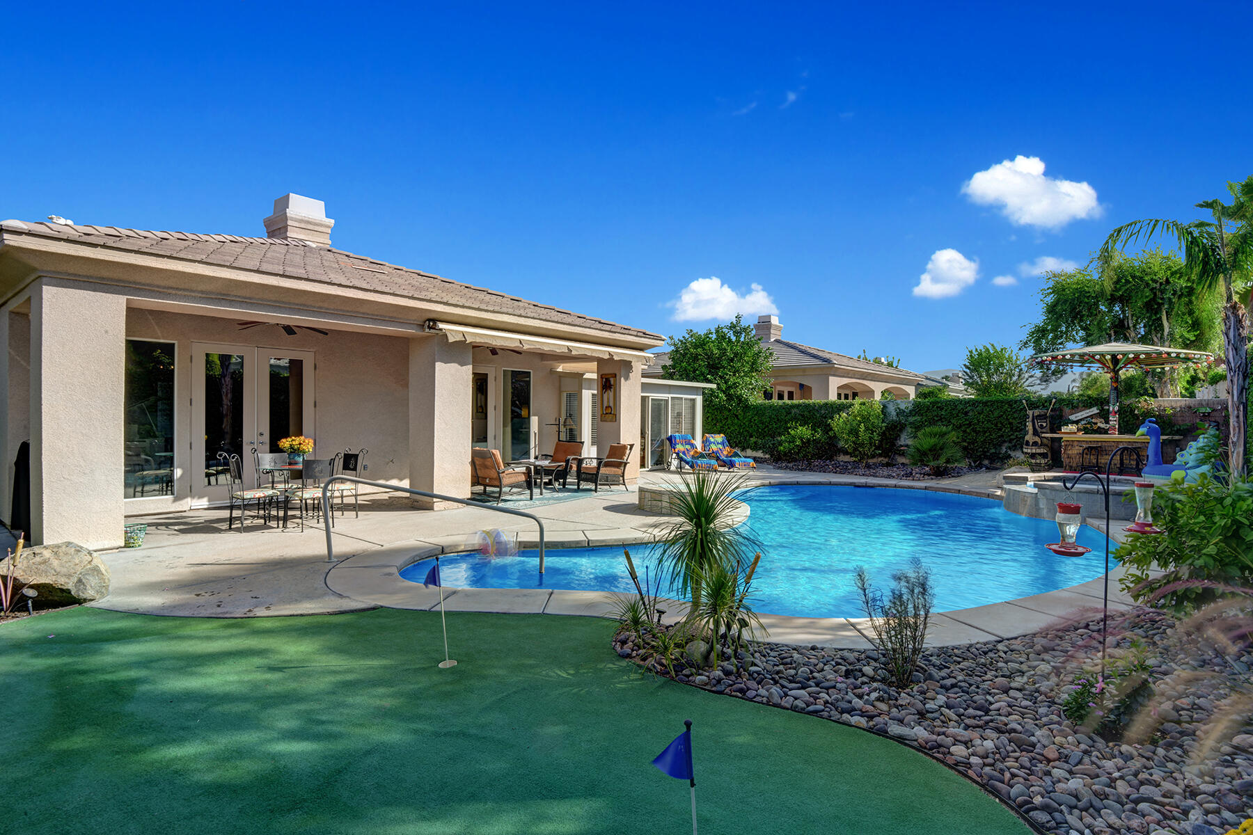 19 Orleans Road Rancho Mirage, CA 92270 - Photo 1 of 32 PUTTING GREEN TO POOL AND HOUSE MLS