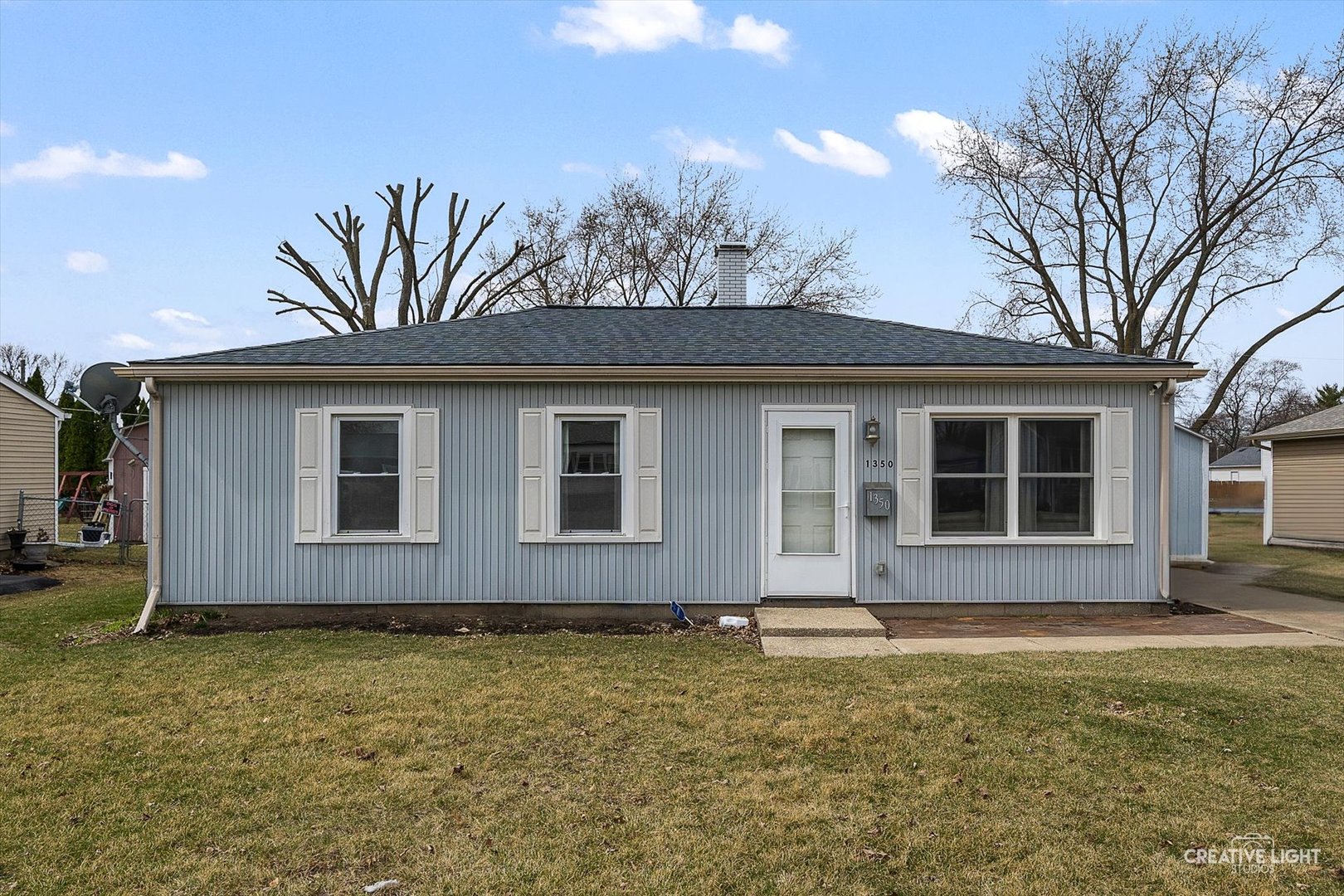 1350 North Russell Avenue Aurora, IL 60506 - Photo 1 of 25 a front view of a house with garden