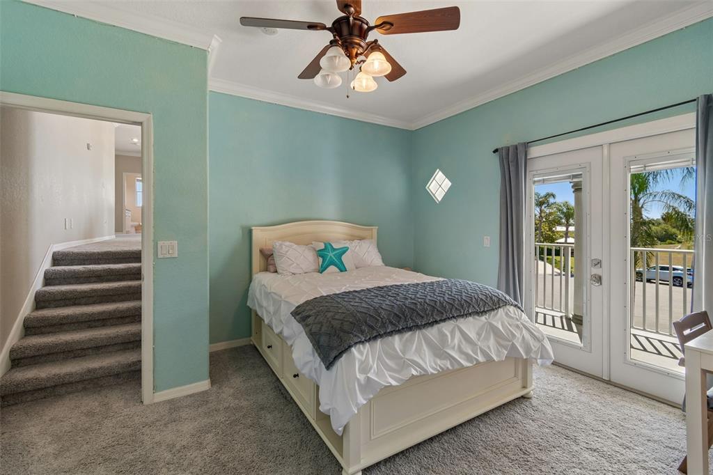 703 Bunker View Drive Apollo Beach, FL 33572 - Photo 35 of 49 a bedroom with a bed and wooden floor