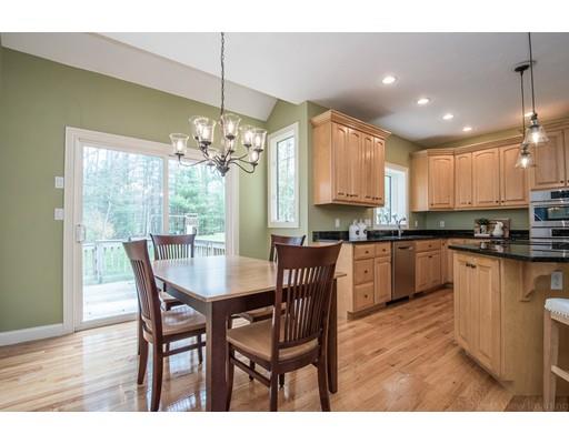 133 Green Road Bolton, MA 01740 - Photo 12 of 30 a kitchen with kitchen island granite countertop wooden floor cabinets and dining table