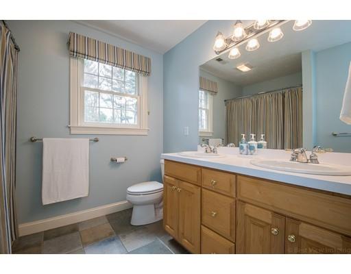 133 Green Road Bolton, MA 01740 - Photo 25 of 30 a bathroom with a sink a toilet and a mirror