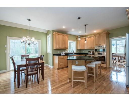 133 Green Road Bolton, MA 01740 - Photo 8 of 30 a kitchen with a dining table chairs and view living room