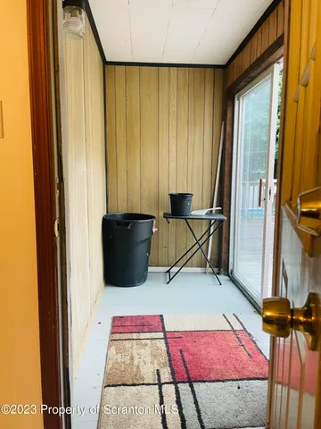 a bedroom with a bed and dresser with mirror