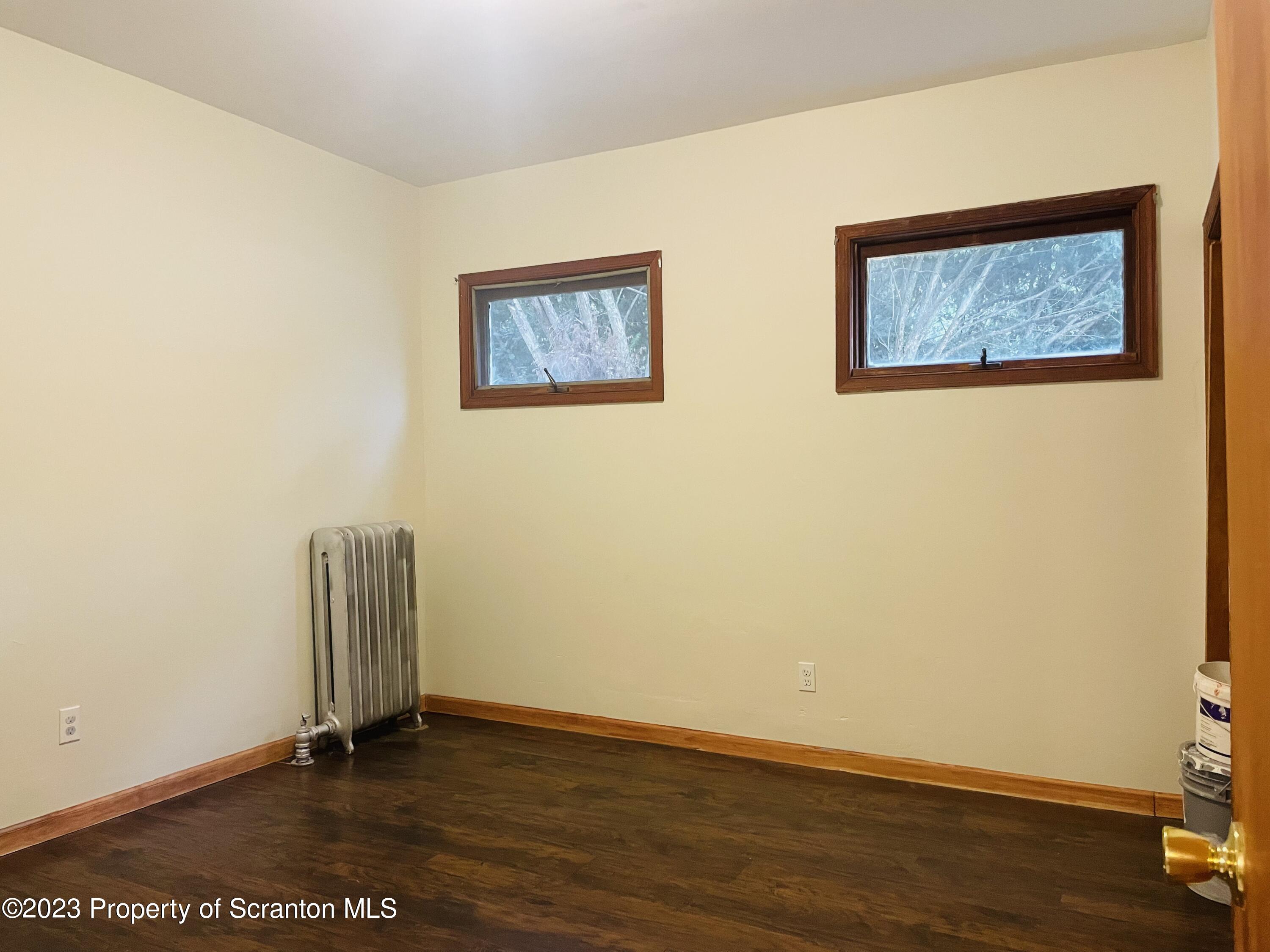 2308 Pond Avenue Scranton, PA 18508 - Photo 18 of 26 a view of an empty room with wooden floor