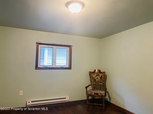 a room with chair and a window