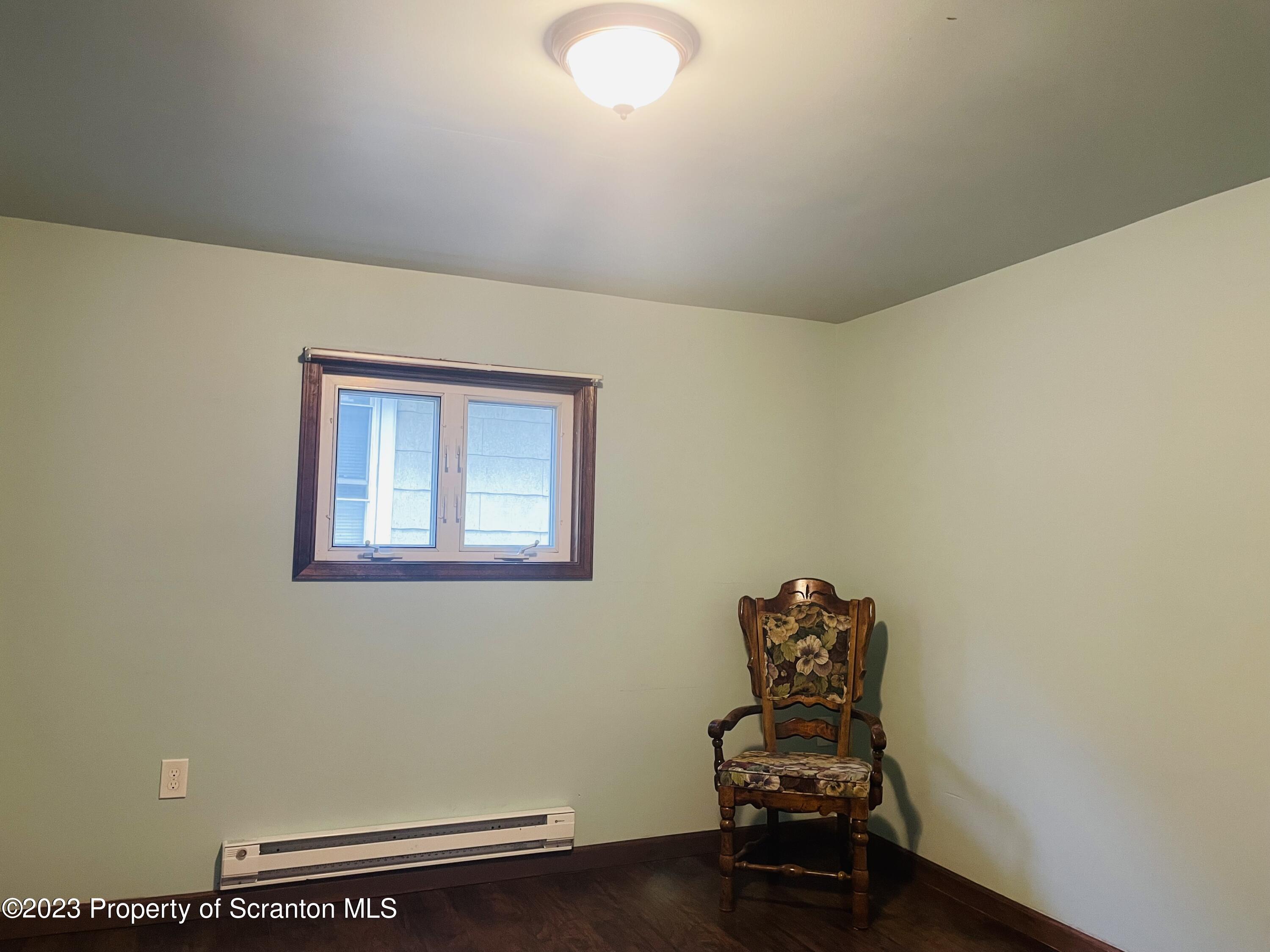 2308 Pond Avenue Scranton, PA 18508 - Photo 19 of 26 a room with chair and a window