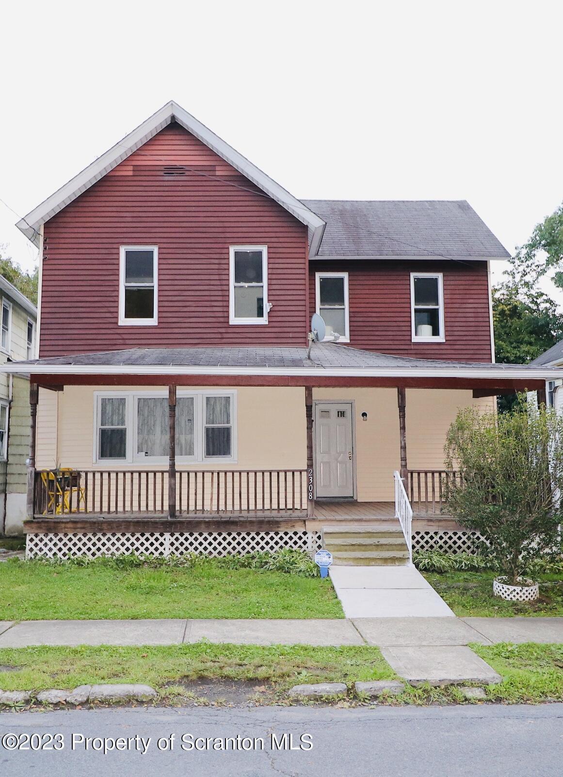 2308 Pond Avenue Scranton, PA 18508 - Photo 2 of 26 a front view of a house with a garden
