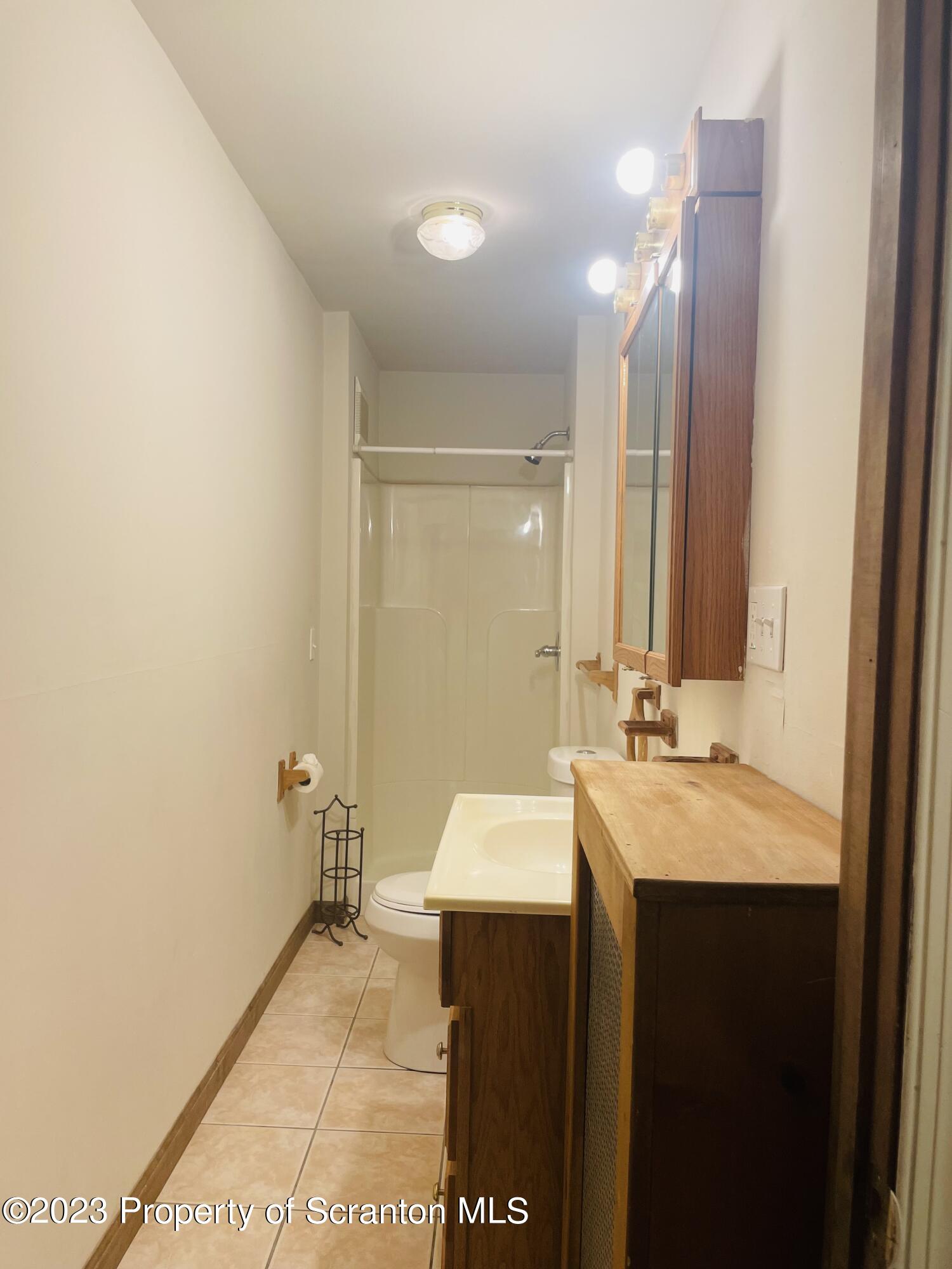 2308 Pond Avenue Scranton, PA 18508 - Photo 22 of 26 a bathroom with a sink and a mirror