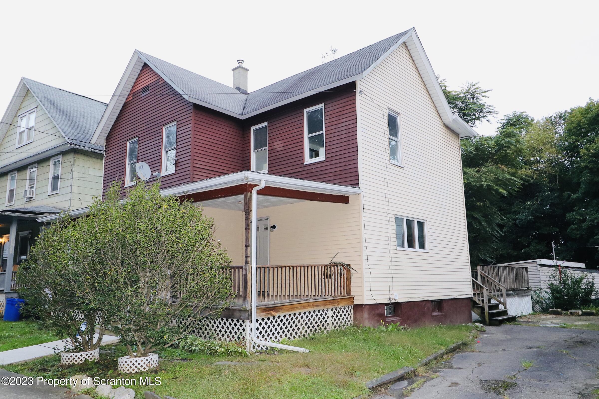 2308 Pond Avenue Scranton, PA 18508 - Photo 5 of 26 a front view of a house with a yard
