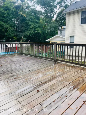 a front view of a house with a wooden floor