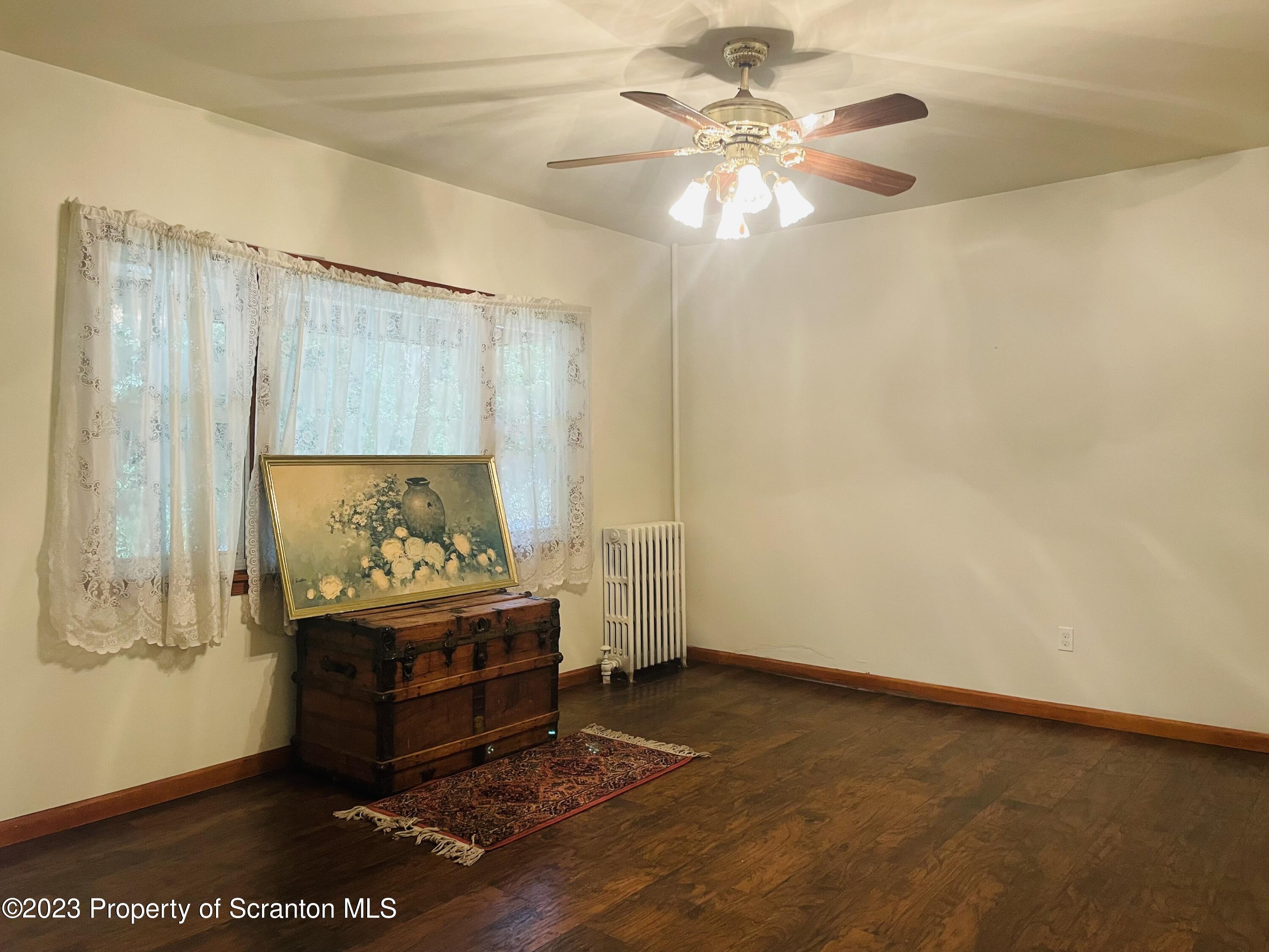 2308 Pond Avenue Scranton, PA 18508 - Photo 9 of 26 a living room with furniture and a chandelier