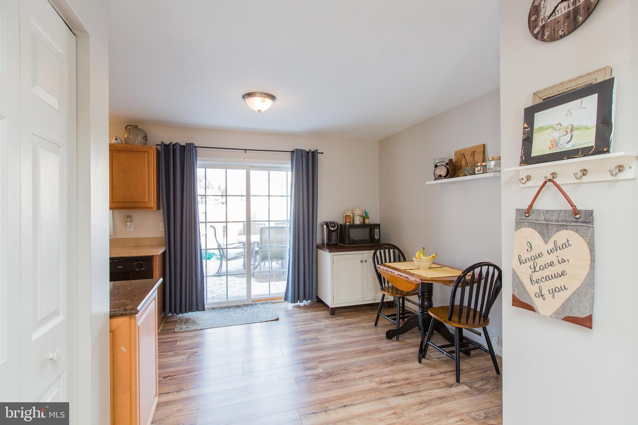 107 Chukar Court Lititz, PA 17543 - Photo 9 of 47 dining area with sliders that lead to deck