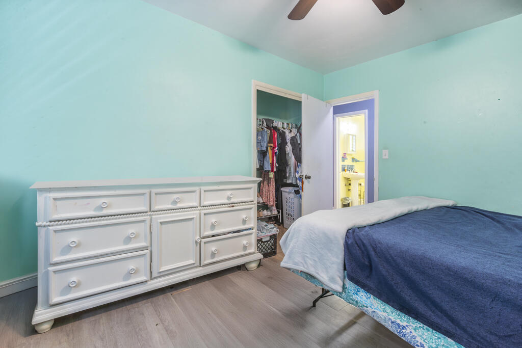 3729 Paula Avenue Key West, FL 33040 - Photo 23 of 28 a bedroom with a bed and a dresser