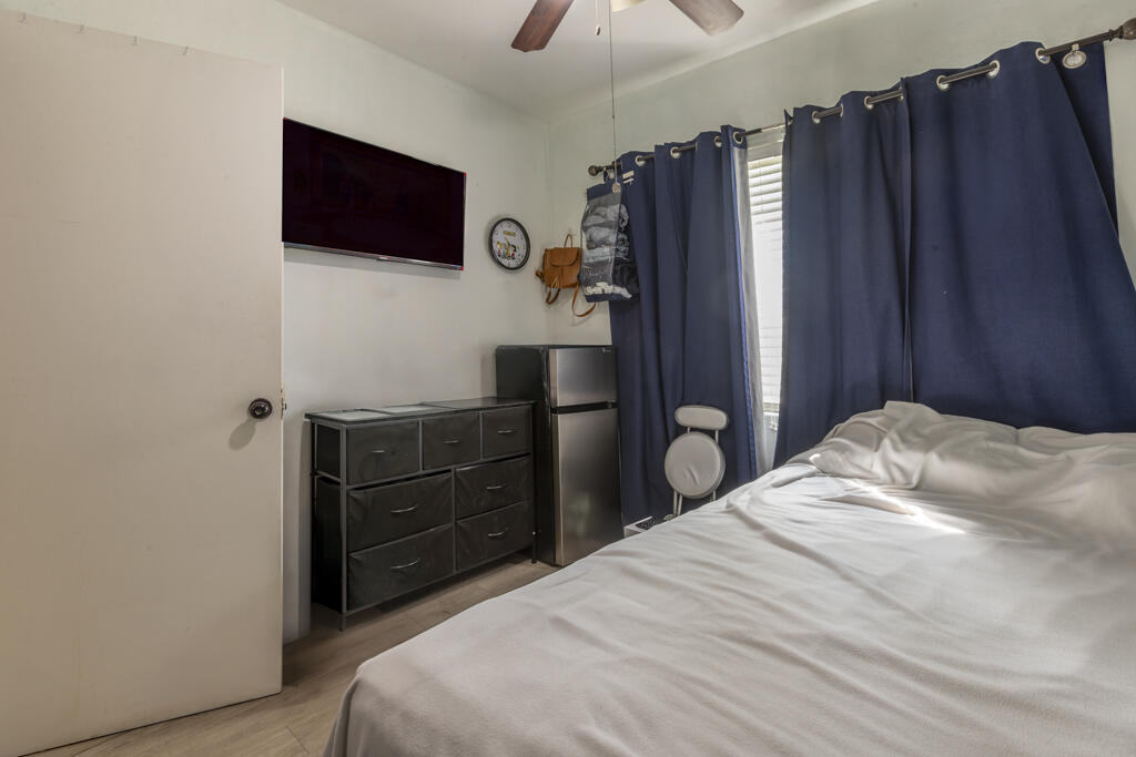 3729 Paula Avenue Key West, FL 33040 - Photo 25 of 28 a bedroom with a bed and a flat screen tv