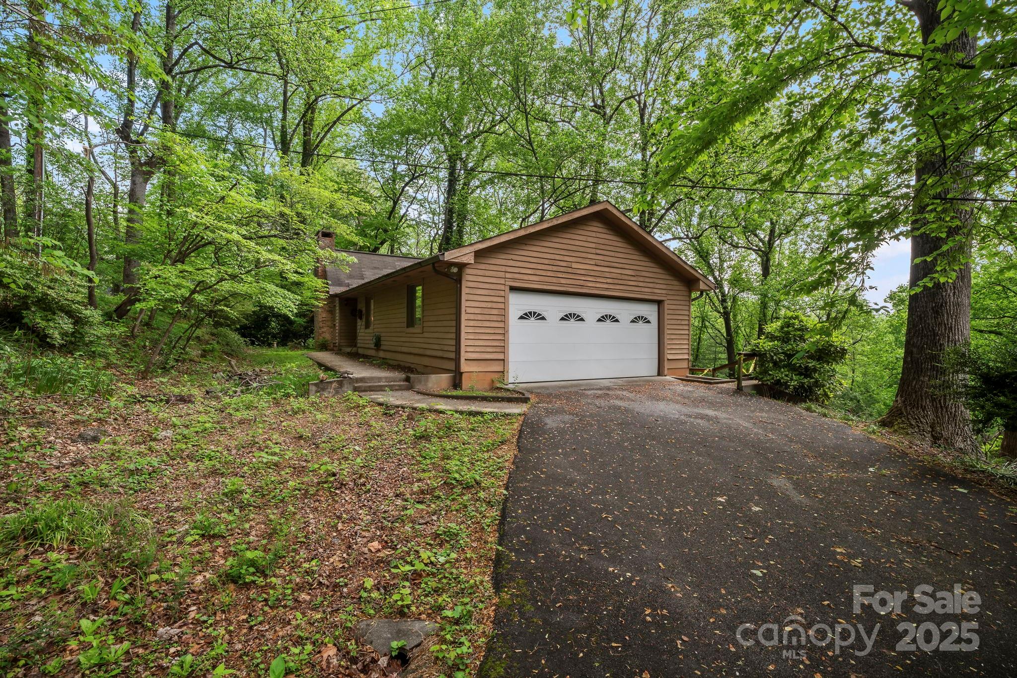 1020 Vineyard Road Tryon, NC 28782 - Photo 35 of 36 a house with trees in the background