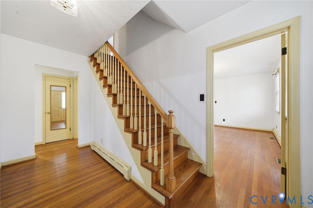 6726 Newtown Road St. Stephens Church, VA 23148 - Photo 13 of 50 a view of a hallway with wooden floor and staircase