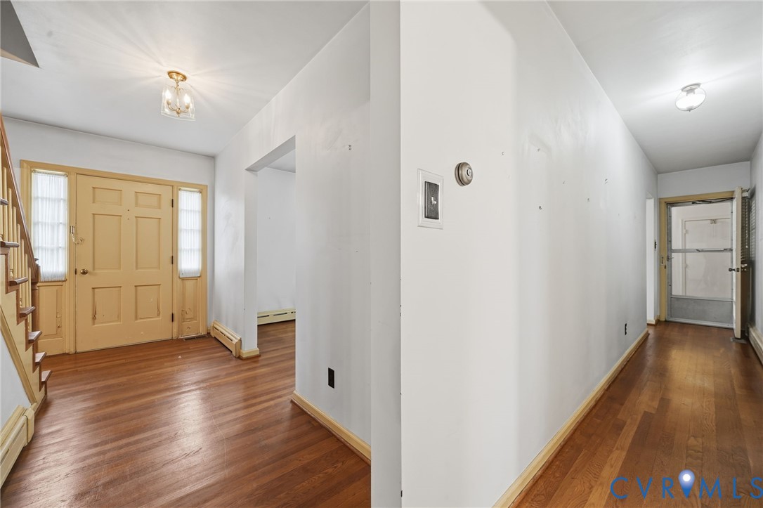 6726 Newtown Road St. Stephens Church, VA 23148 - Photo 14 of 50 a view of an empty room with wooden floor and a window