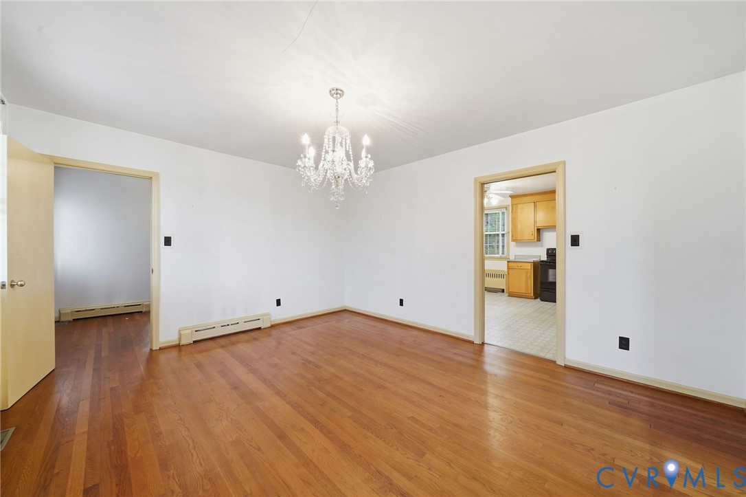 6726 Newtown Road St. Stephens Church, VA 23148 - Photo 15 of 50 a view of a big room with wooden floor and staircase