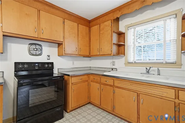 a kitchen with a sink stove and cabinets