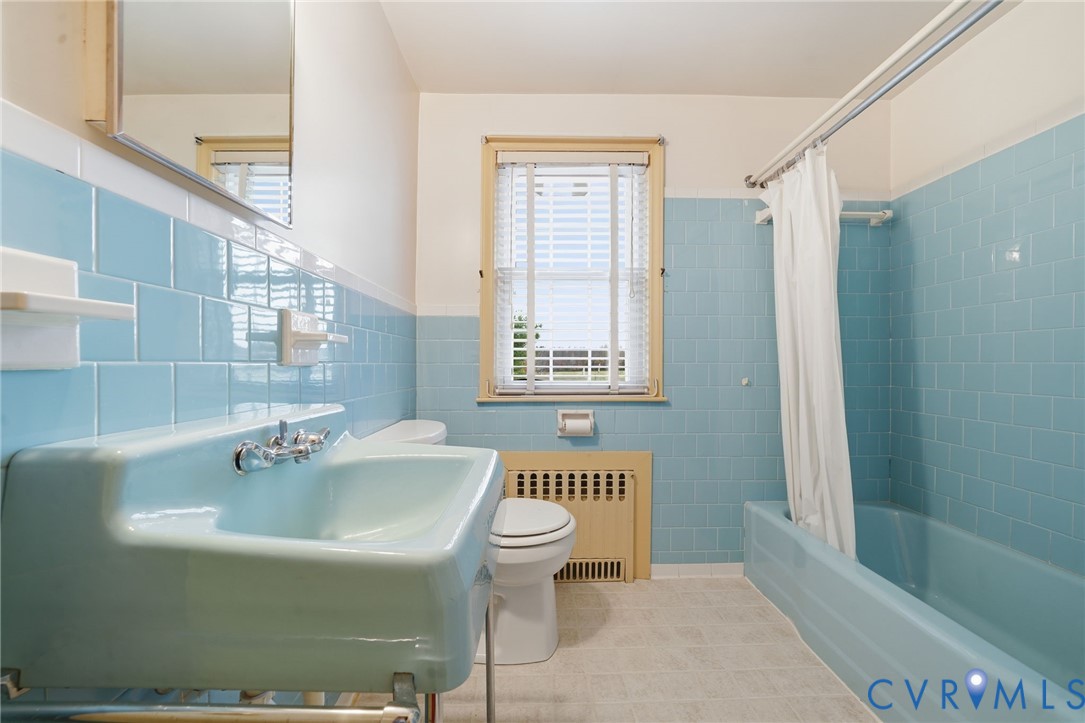 6726 Newtown Road St. Stephens Church, VA 23148 - Photo 33 of 50 a bathroom with a sink a toilet and shower